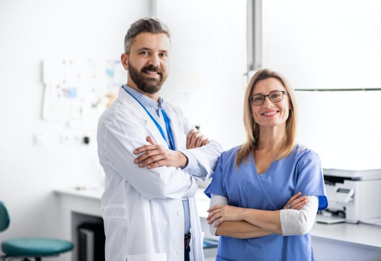 A dentist with dental assistant in modern dental surgery